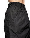 MINOAR - ASPECT LAYERED CONSTRUCT SKIRT TROUSERS, IN BLACK